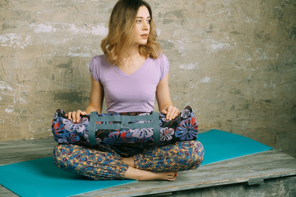 women holding a yoga mat and bag sets