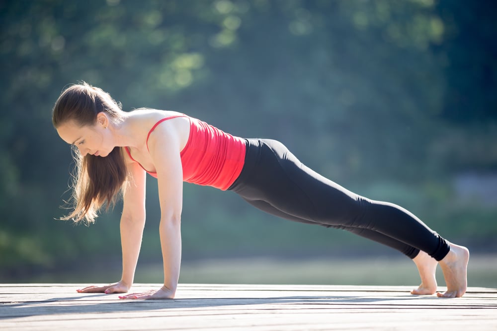 Teenage girl in plank pose