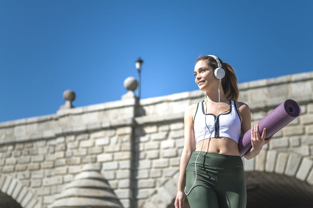 Women wearing inexpensive, budget-friendly earphones